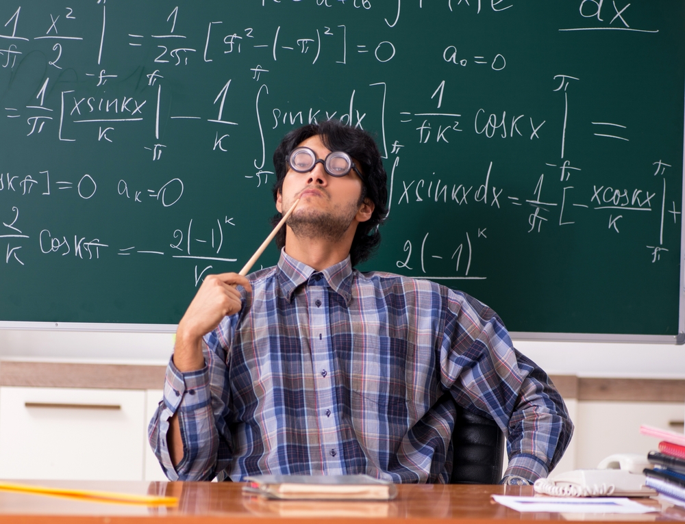 Funny male math teacher in the classroom