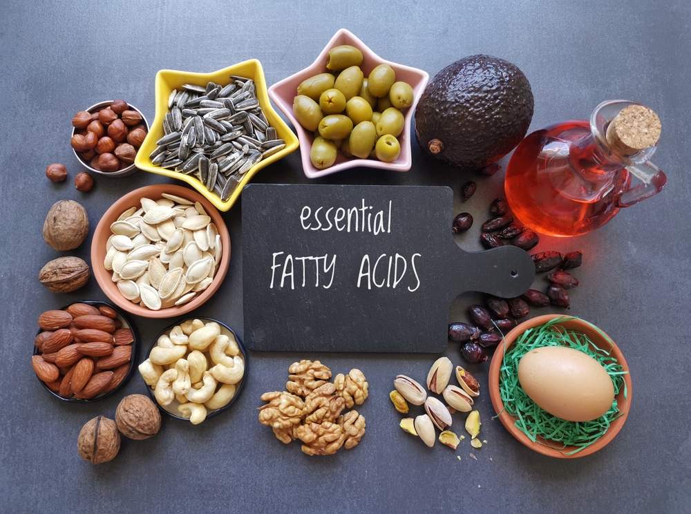 Food high in linoleic acid. Natural food sources of omega 6 and omega 3 essential fatty acids. Good fats - nuts, seeds, oils, vegetable; concept of healthy and balanced diet.