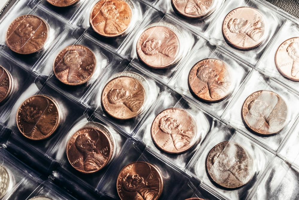 Photo of US president Lincoln cent coins collection in a clear plastic sheet numismatic holder.