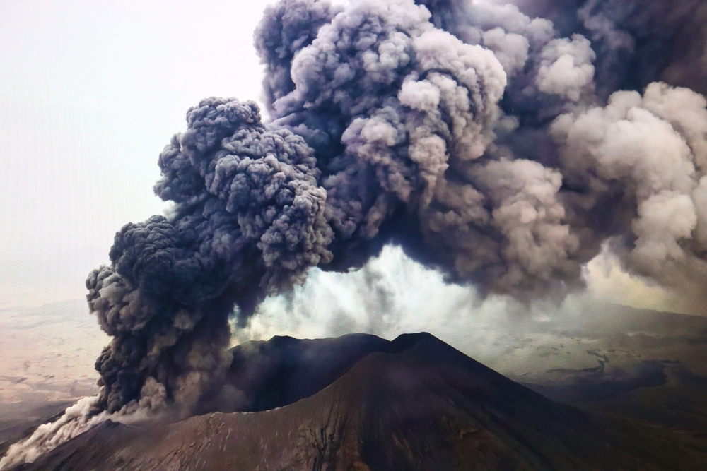 A massive volcanic eruption sends a towering plume of ash and smoke into the sky, capturing the dramatic power of nature above the clouds, Ethiopia Volcano. Ethiopia, 27 November 2025