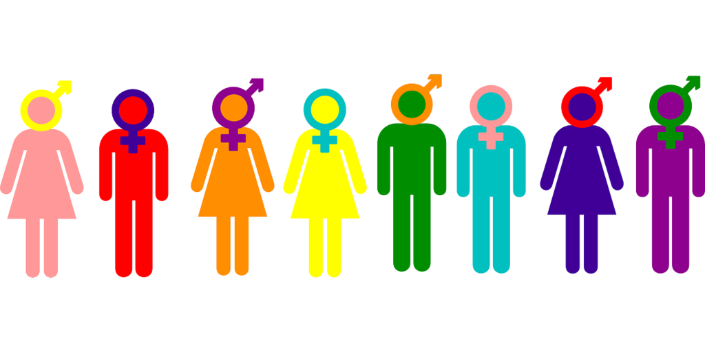 A row of nine colorful human figure icons in rainbow colors. Each figure has a different gender symbol on its head, including combinations of the traditional male and female symbols. The figures alternate between dress-wearing and pants-wearing shapes.