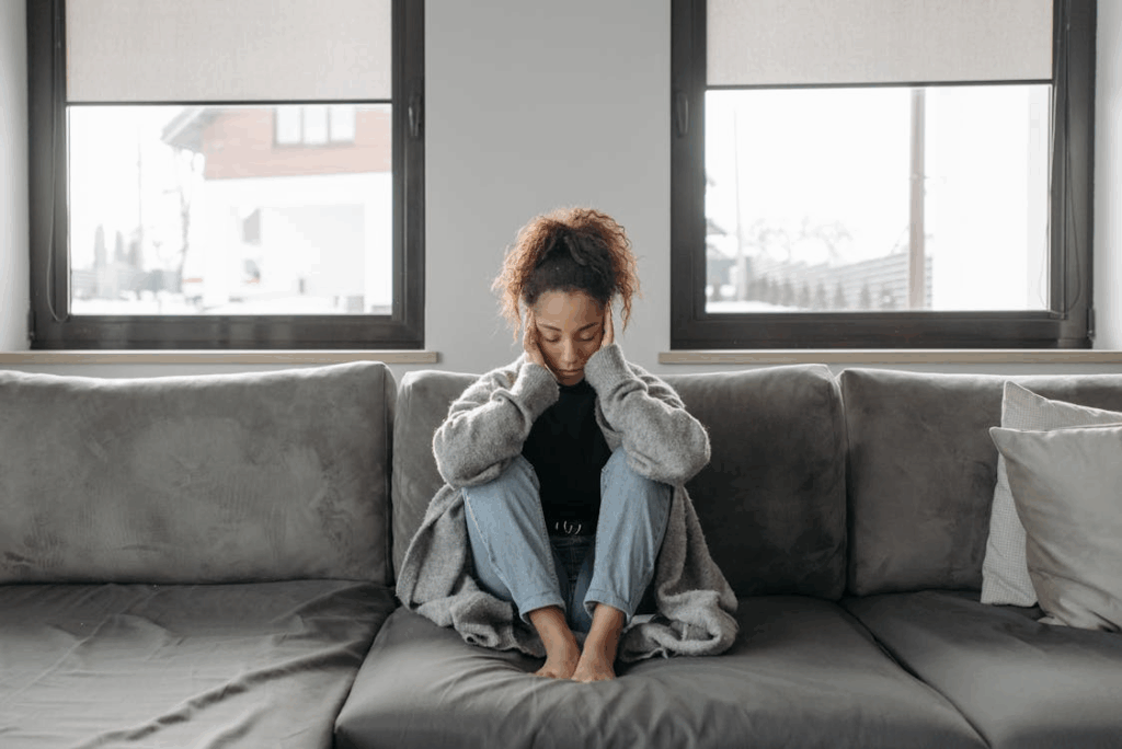 Woman Sitting On A Sofa
