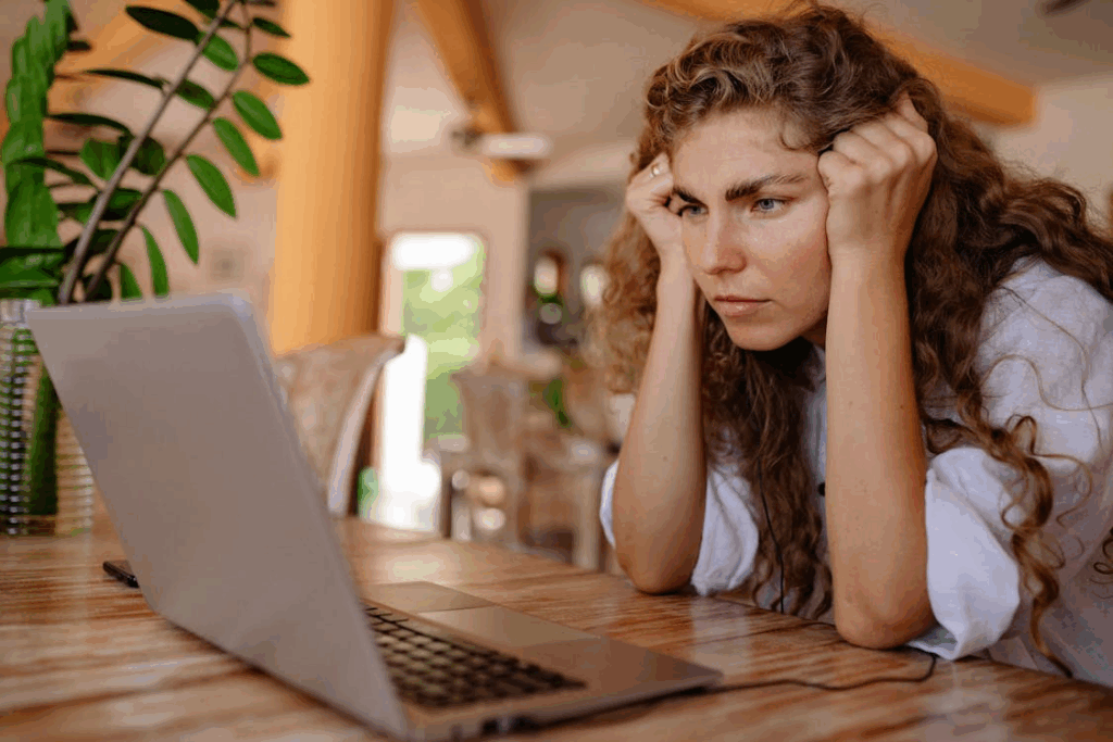 A Woman Looking a Laptop, curious about Baba Vanga predictions