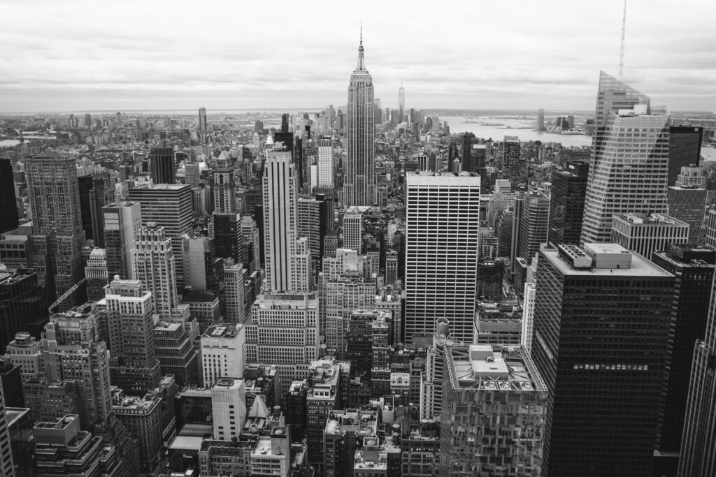 Grayscale Photo Of City Buildings
