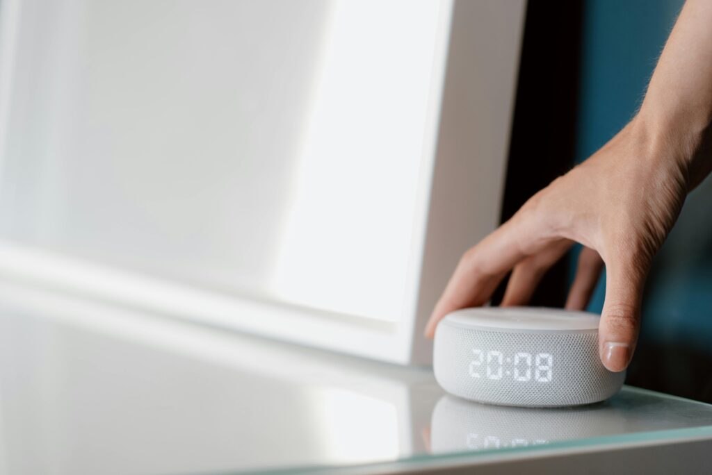 A Person Holding White Electronic Device