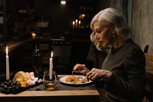 Senior woman eating dinner