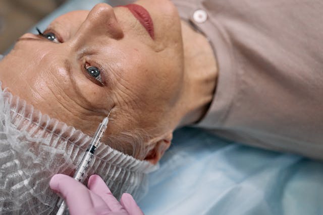 Elderly lady getting an injection