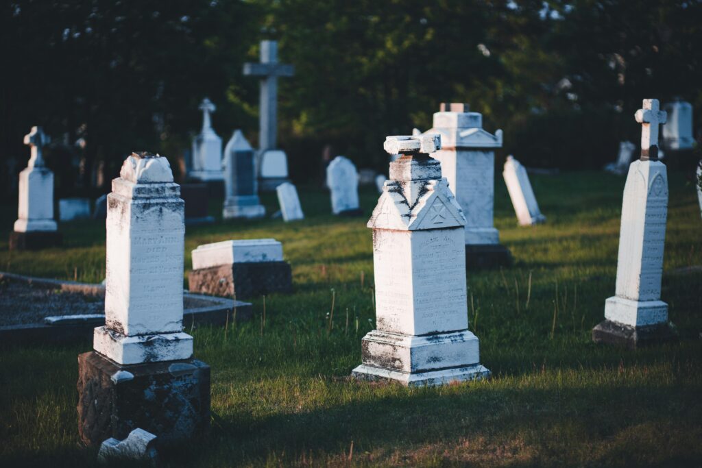 White Cross on Top of Tombstones
