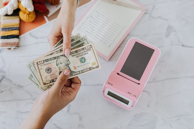 woman handing over money