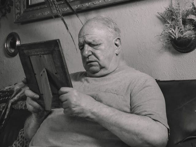 Man looking at photo