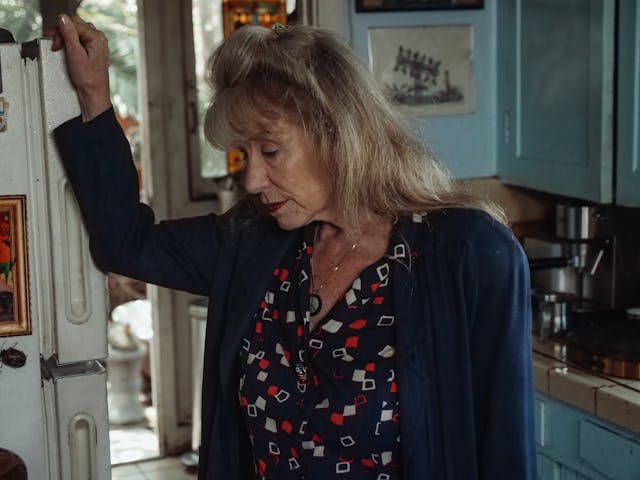 elderly owman in kitchen