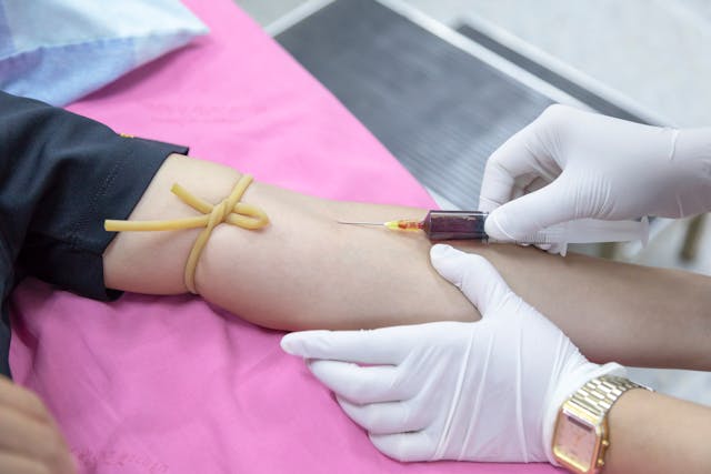 drawing blood from patient