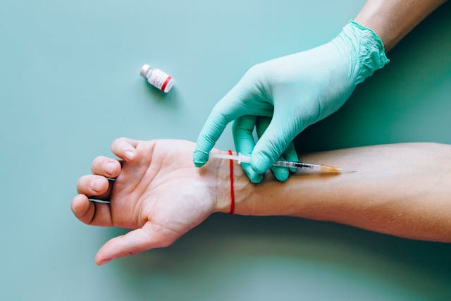 doctor giving patient a vaccine