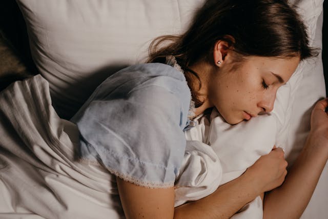 woman sleeping in her bed