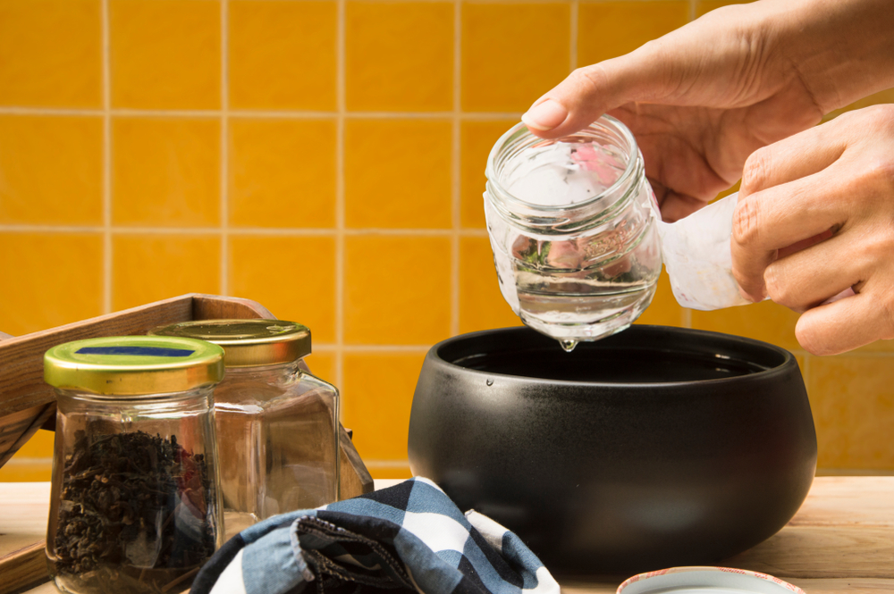 after soak glass jars in boiling water, leave it's cool until you can handle, easily peel label without leave bits of paper and glue residue