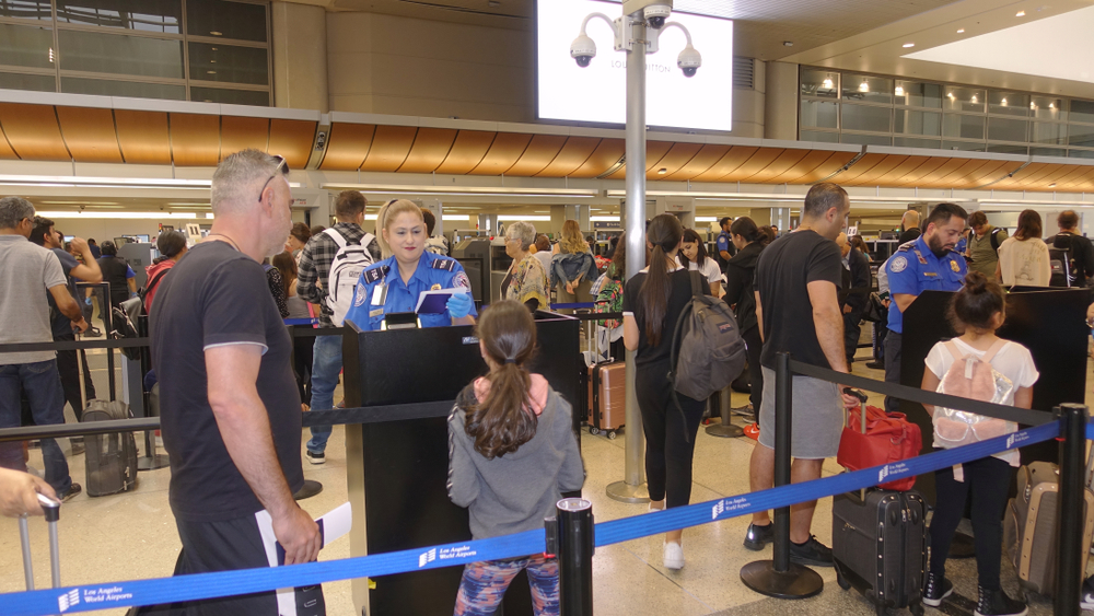 Los Angeles, CA / USA - June 12, 2019: People at TSA security passport checkpoint at Los Angeles International Airport (LAX)                                 