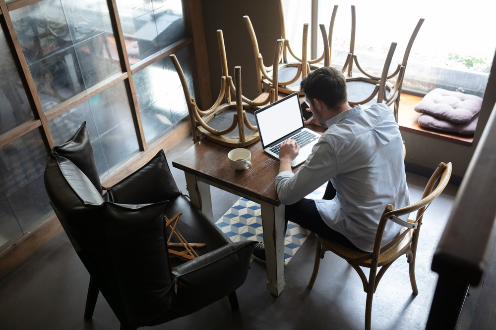 Restaurant, cafe, bar closed due to COVID-19 or Coronavirus outbreak lockdown, stressed owner of small business, depression. Businessman exhausted, upset. Business, economy, finance crisis.