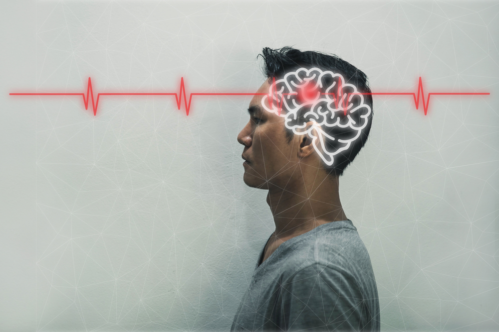 Red epicenter of the pain of brain. The silhouette of a man's head and volume image of the brain. brain stroke concept.headache.