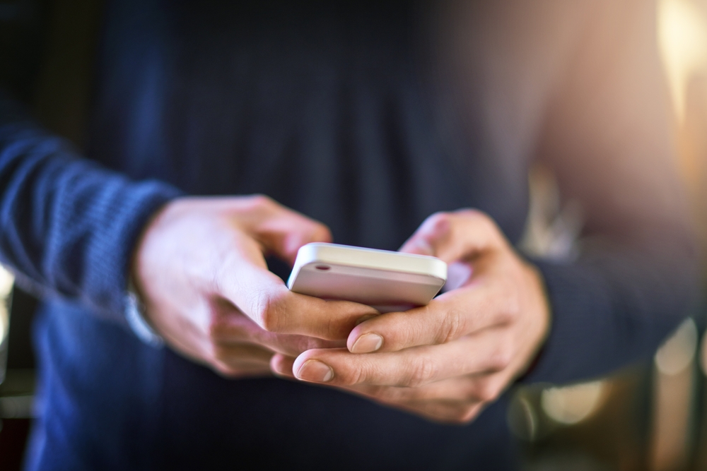Phone, hands and texting, social media or online browsing, networking and messaging. Cellphone, hand and man typing, web scroll or internet, website and mobile app for communication, chat and tech.