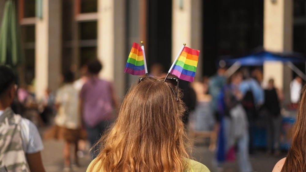 Gay person wear little lgbt rainbow flag head top. Multi-colored pride parade symbol. Same sex love sign. No stop homophobia concept. Csd day fest. Bi coming out party. Lgbtq hair style. Queer culture