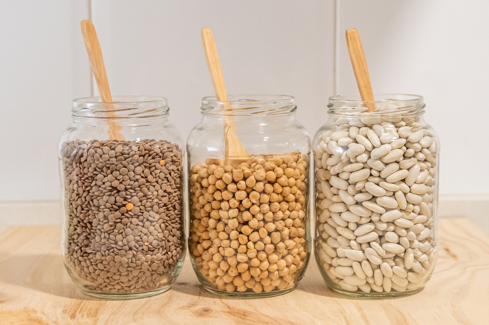 Sustainable Pantry Organization With Glass Jars Holding Lentils, Chickpeas, And Beans. Sustainable Storage Of Bulk Organic Foods