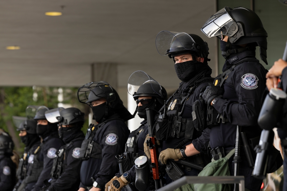 Los Angeles, California, USA - June 10, 2025: U.S. Customs and Border Protection (CBP) field officers guard a federal building during ICE deportation protests in Downtown LA.