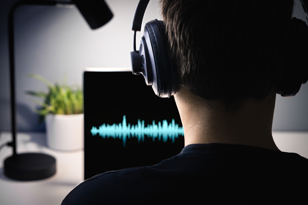 AI deepfake voice scam. Deep fake clone. Music or sound generator. Espionage, fbi police wiretap or audio intelligence. Producer editing with headphones. Spy secret listening. Fraud vocal call.