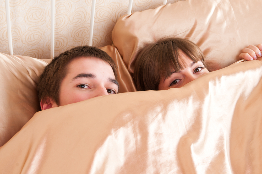 young couple in a bed