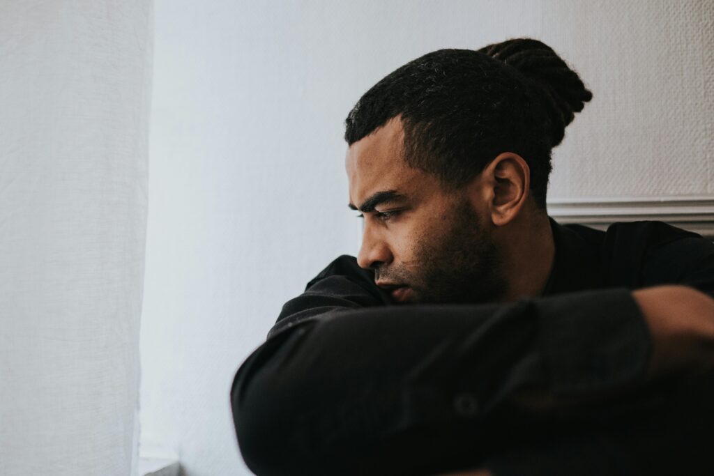 Man Sitting and Looking Sad