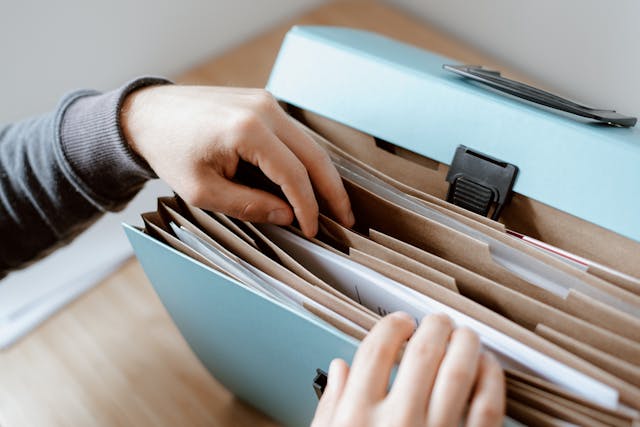 person searching through the files