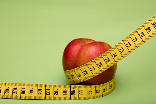 measuring tape around peach