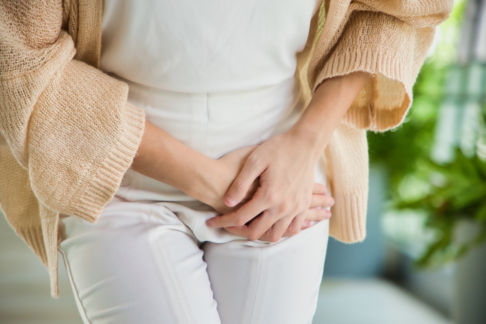 Healthcare Concept Image, Asian woman holding her pee, health care concept of UTI urinary tract infection; urinary incontinence; overactive bladder symptoms, isolated background