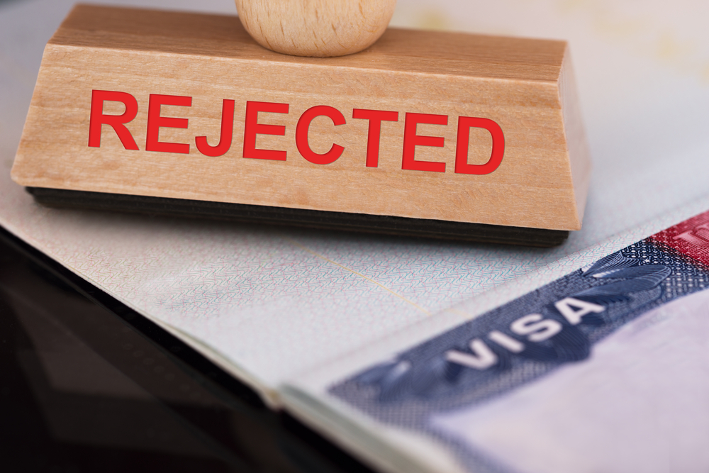 Close-up Photo Of Rejected Stamp On Visa