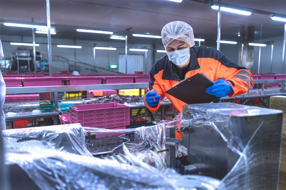 Food and manufacturing researchers oversee seafood production lines in tightly controlled factories where machinery is used to produce and cook food before it is shipped out.