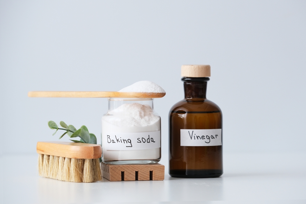 Natural household cleaning products on a white surface in the kitchen, natural lighting. Eco-conscious and environmentally friendly choice. Zero waste concept. 