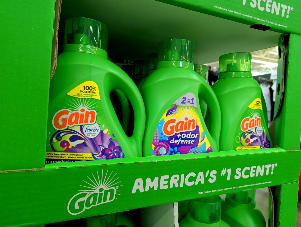 Apex, North Carolina - May 8 2025: Gain Scented Detergent Bottles on Shelf Logo Display Walmart 