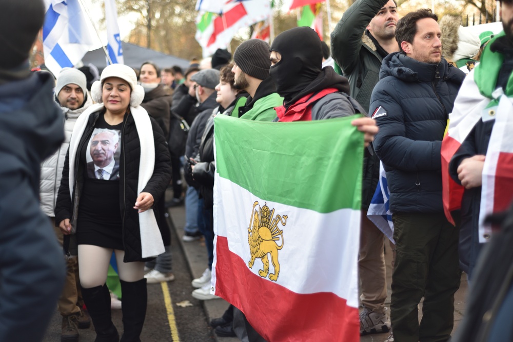 A protester wearing a balaclava holds up flag. Iranian Embassy Protest in London UK. Regime change in Iran. 3rd January 2026