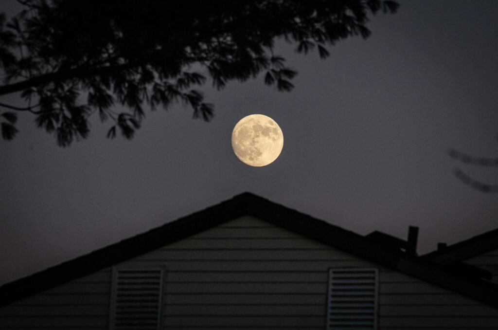 White and Black House Under Full Moon