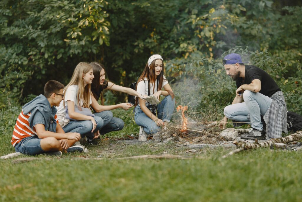 A Group of Friends Looking at the Bonfire