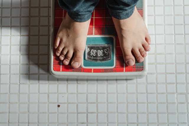 person standing on scale