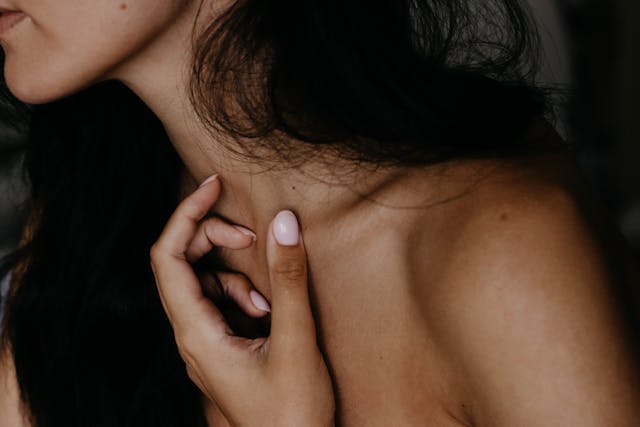 woman checking lump on body