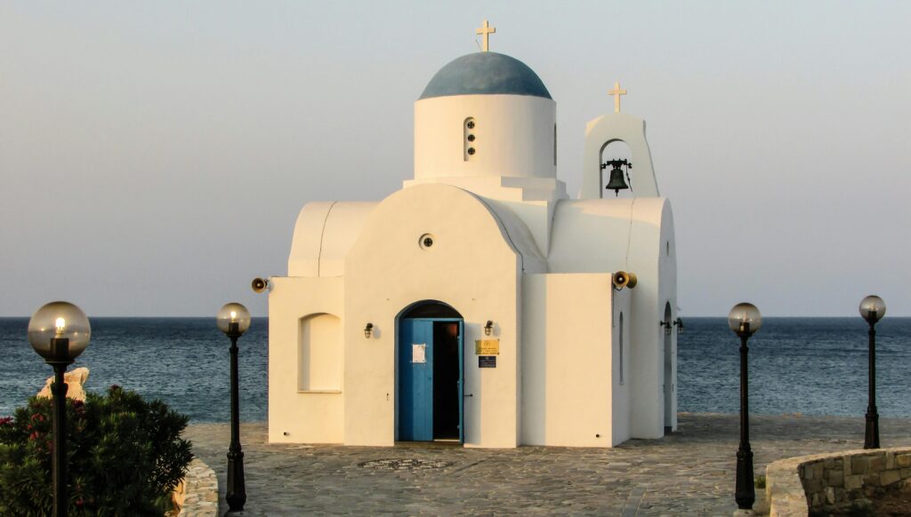 White Church Photo Near Ocean