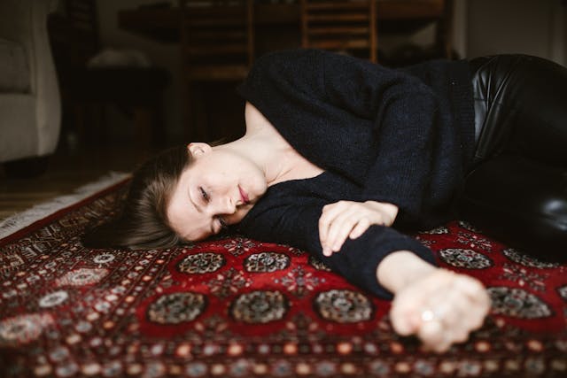 woman lying on floor