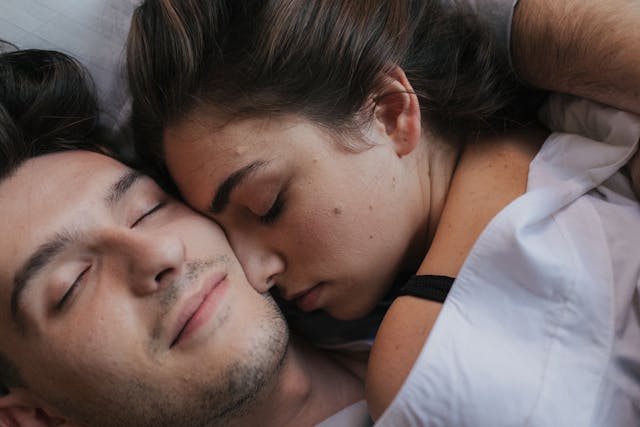 man and woman in bed
