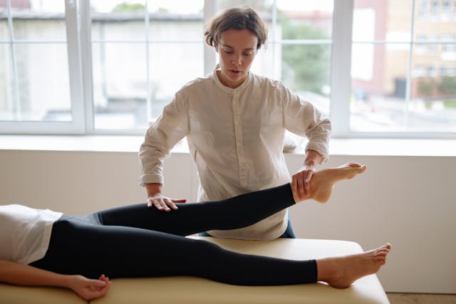 doctor checking patient's leg