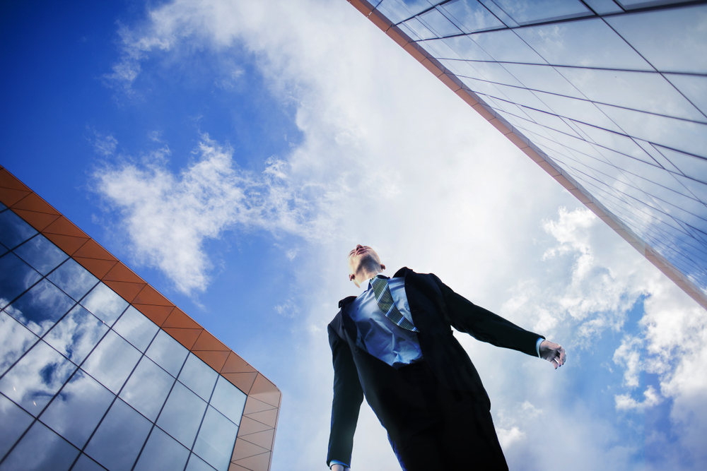 businessman looking at the sky. The concept of an ambitious person, goal-setting