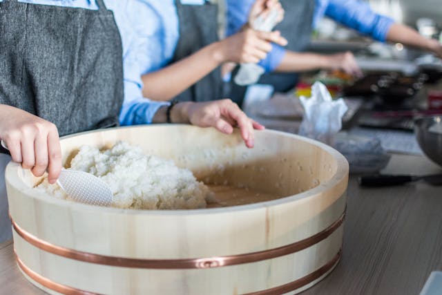 Chinese woman turning rice