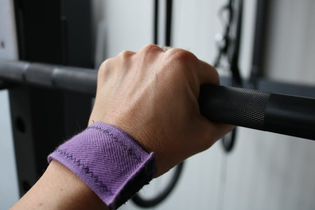 hand gripping bar