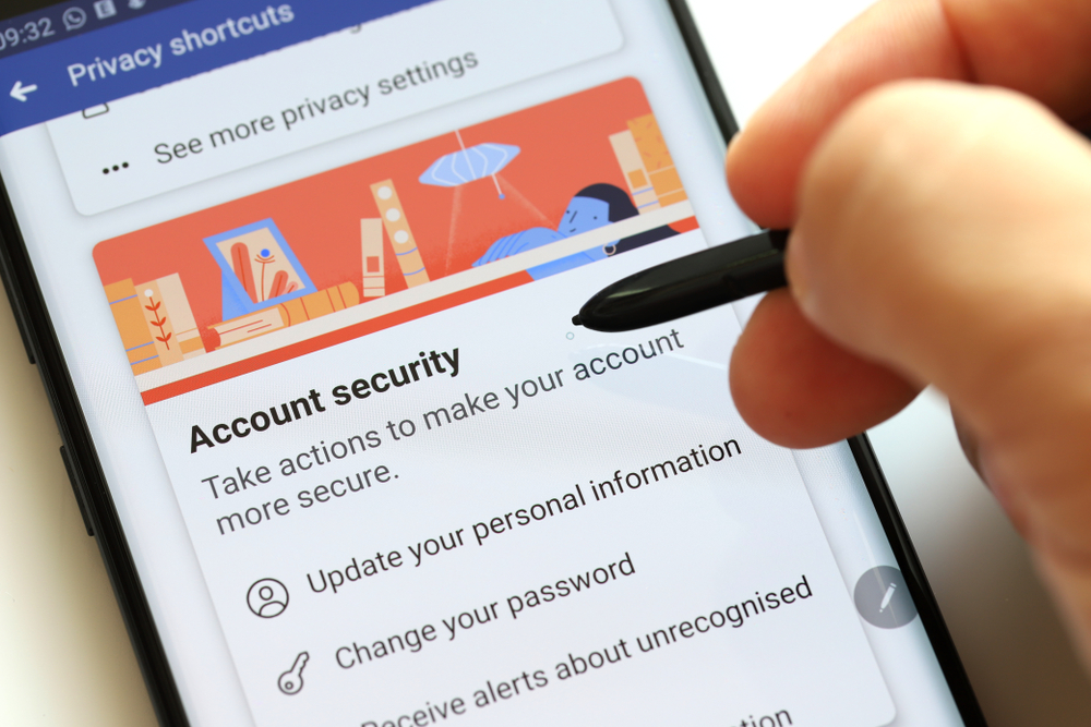 PENANG, MALAYSIA - 26 JULY 2019: Facebook security and privacy issues. Close up man browsing smartphone with Facebook privacy check-up page. It is an American online social media networking company.