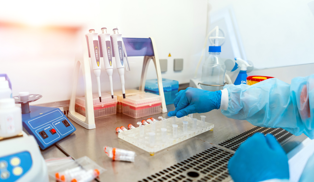 Professional laboratory assistant taking blood test for DNA research. Healthcare and biotechnology. DNA research. Cropped photo.